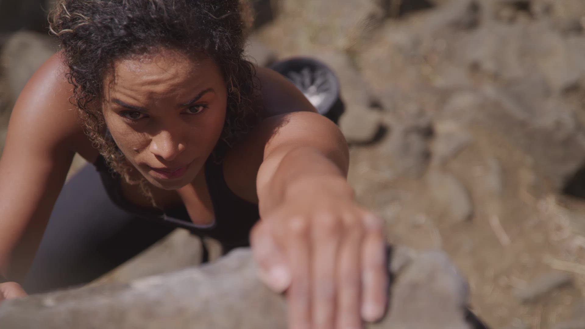 Rock Climber Making Her Way Up The Cliff FILMPAC