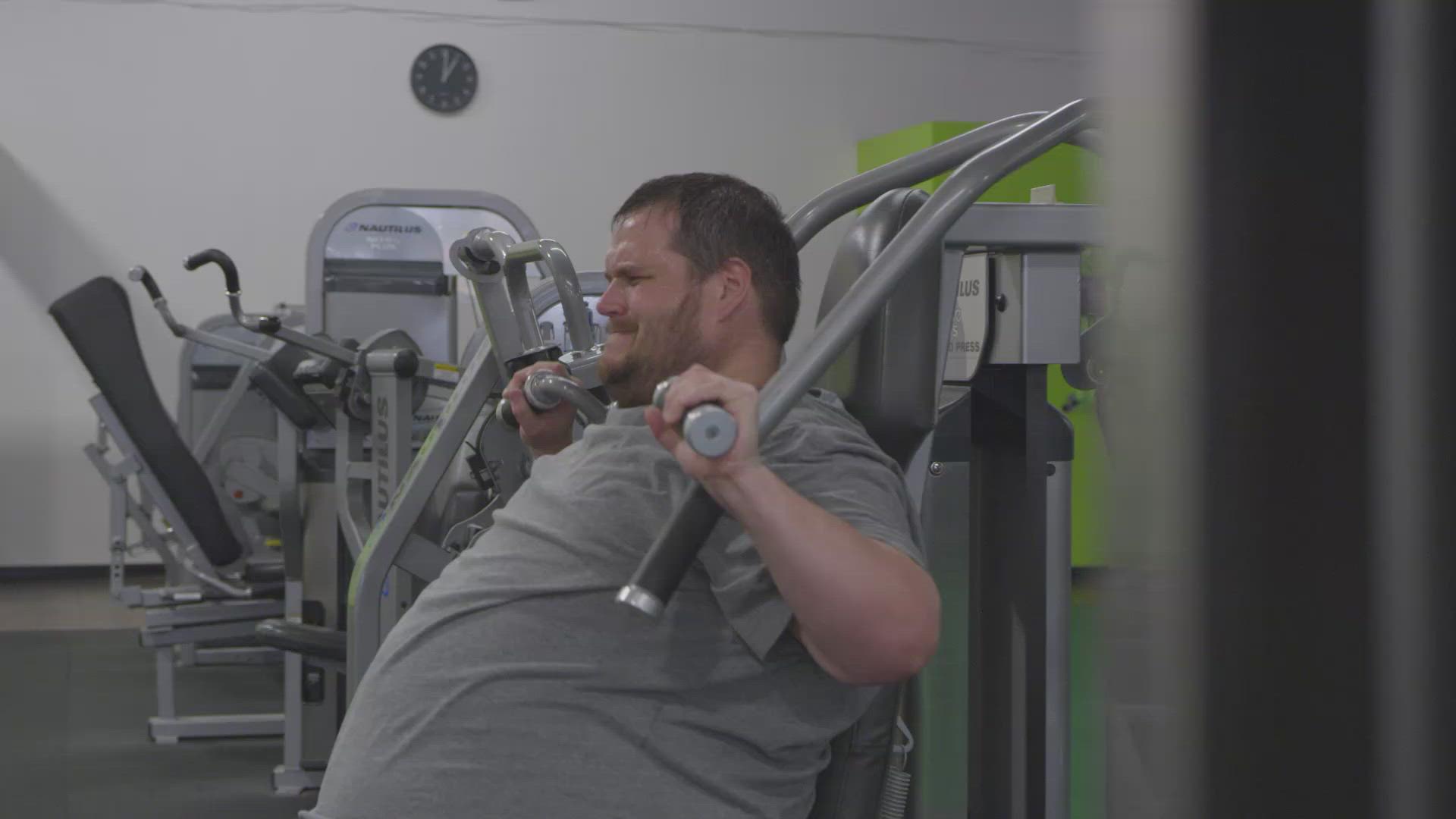 Overweight Guy Lifting Weights at the Gym FILMPAC