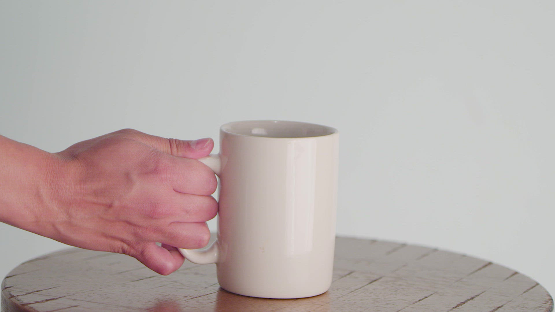 Person Picking Up Coffee Mug FILMPAC