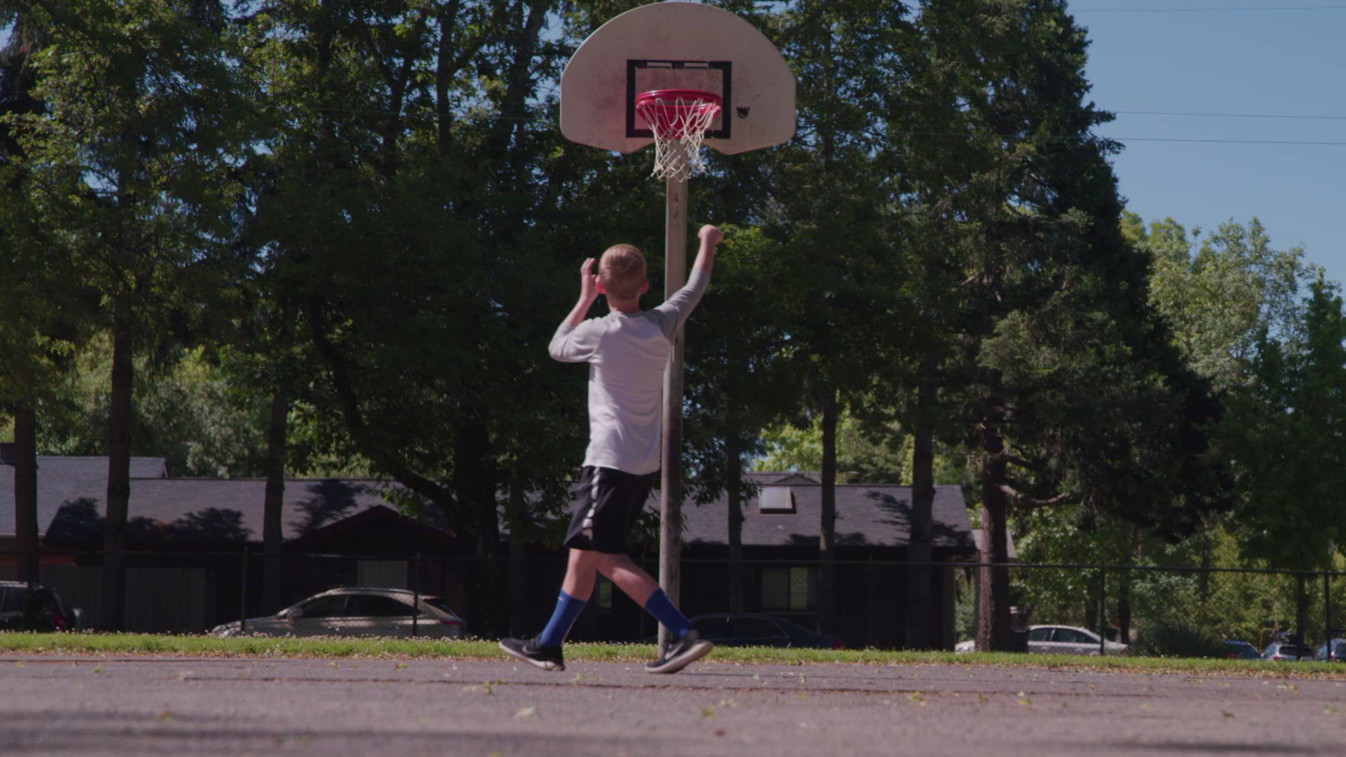Boy Shooting Hoops at Park FILMPAC