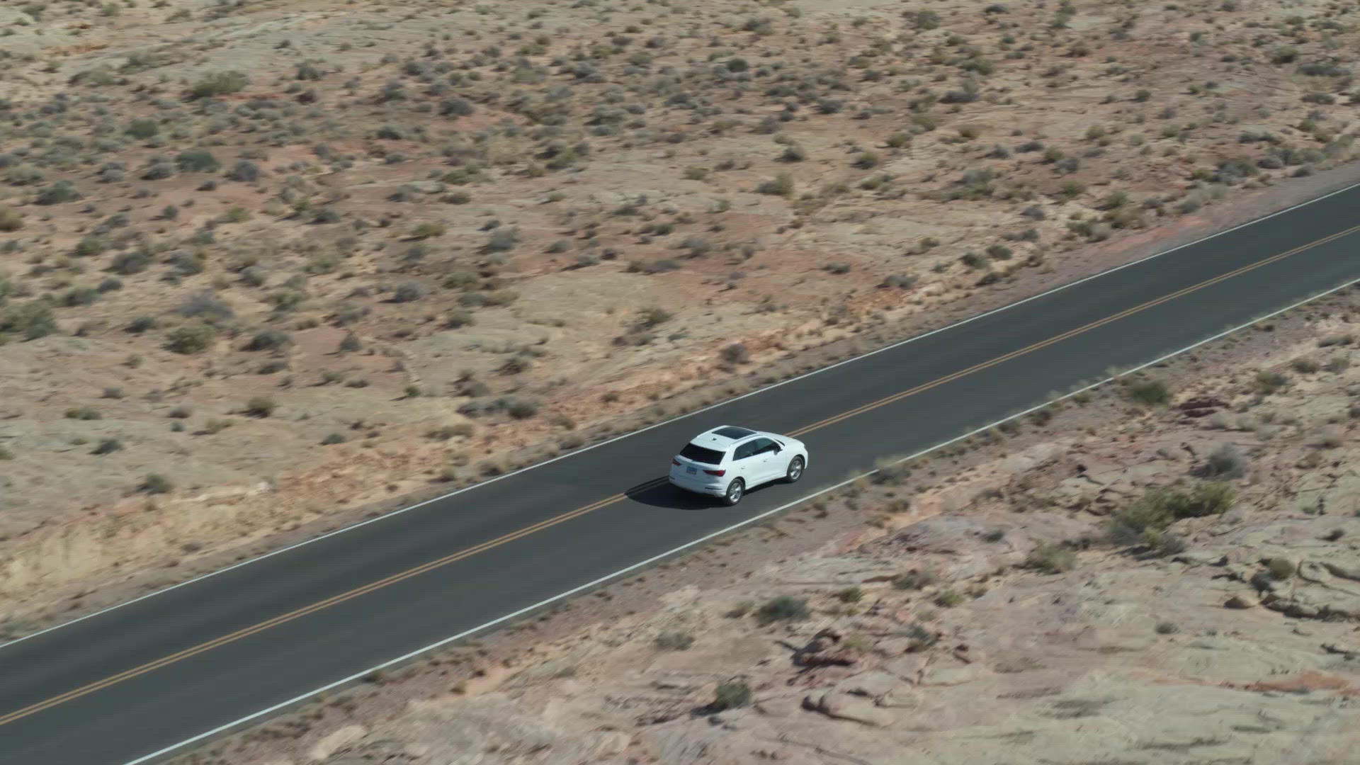 Aerials of Car Driving on Windy Road in Utah FILMPAC